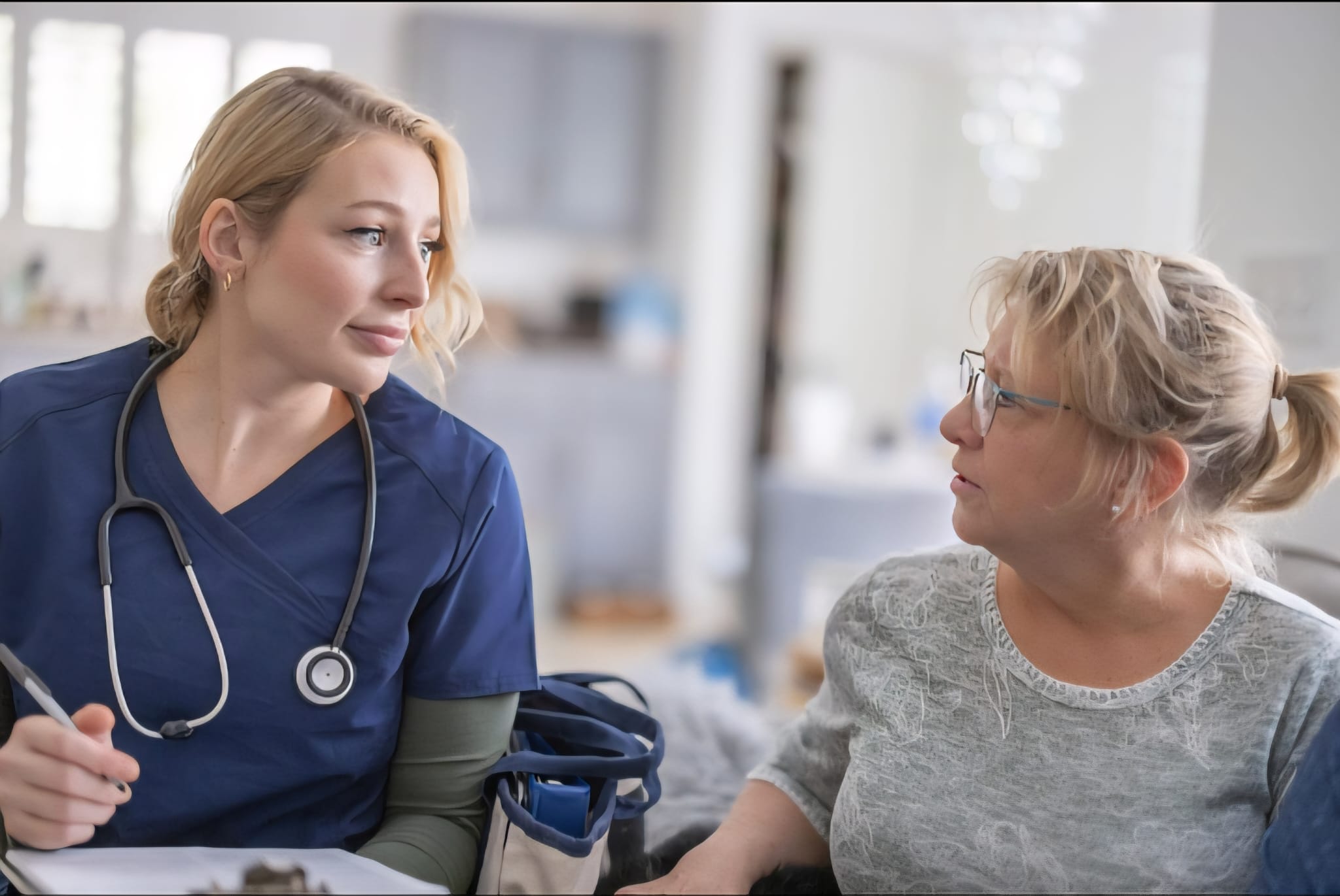 Home health nurse providing skilled nursing care to client